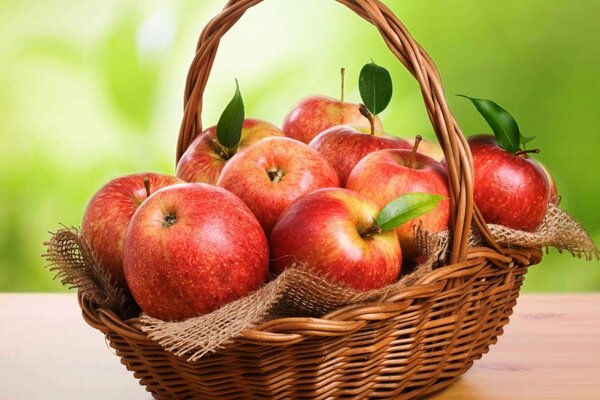 Red apples in a basket on the table