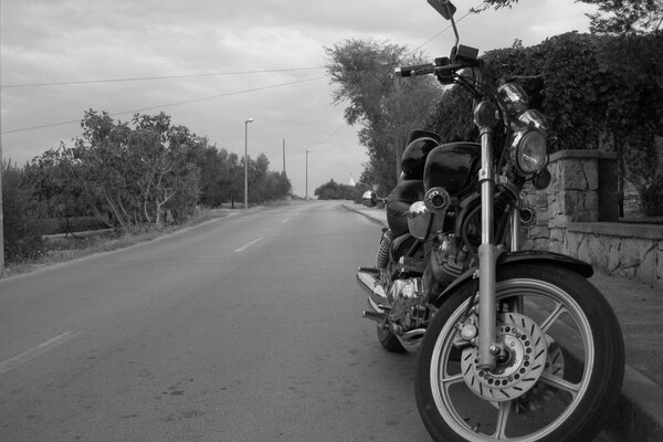 Motorcycle on the road black and white picture