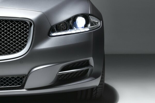 Jaguar grey car lights up