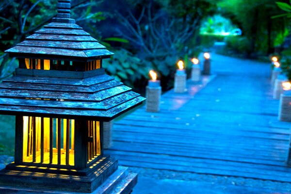 Night wooden walkway with street lights