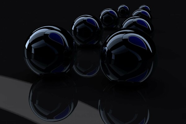 Voluminous black balls on a black background