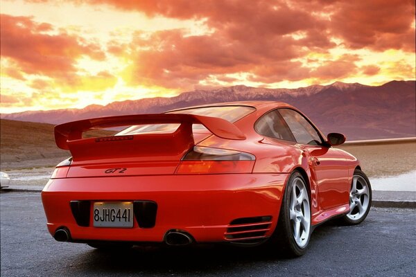 Red sports car against the sky