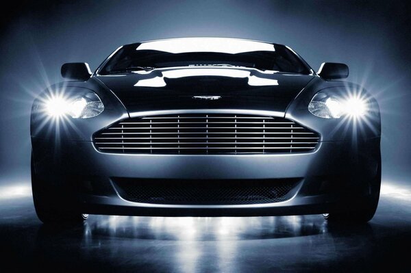 The front of the aston Martin car on a gray background