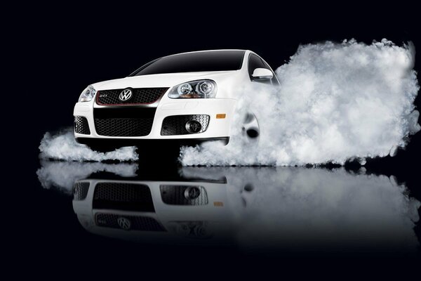 Volkswagen in a splash of water on a black background