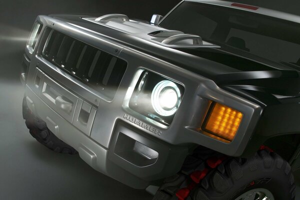 Hummer close-up with headlights on