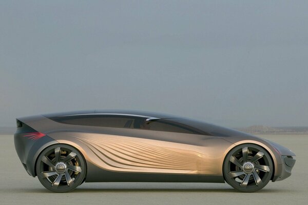 Futuristic Mazda concept against the background of a lake and emptiness