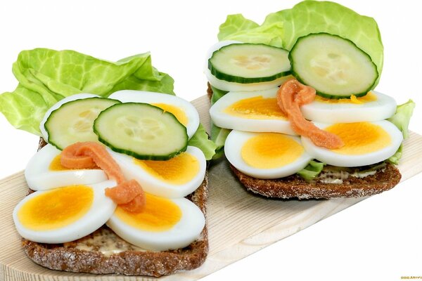 Sandwich with cucumber, egg and herbs