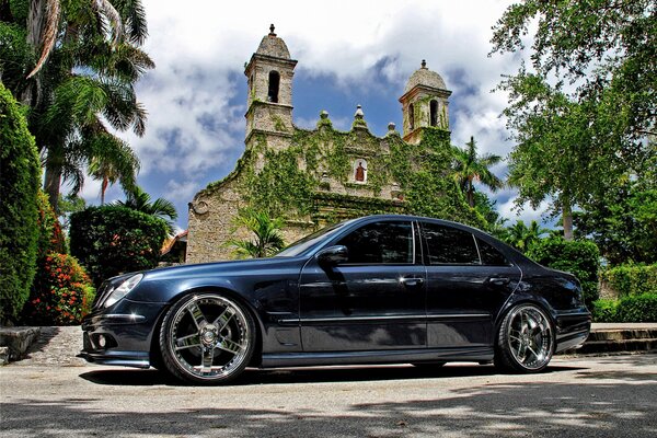 Black Mercedes in front of the church