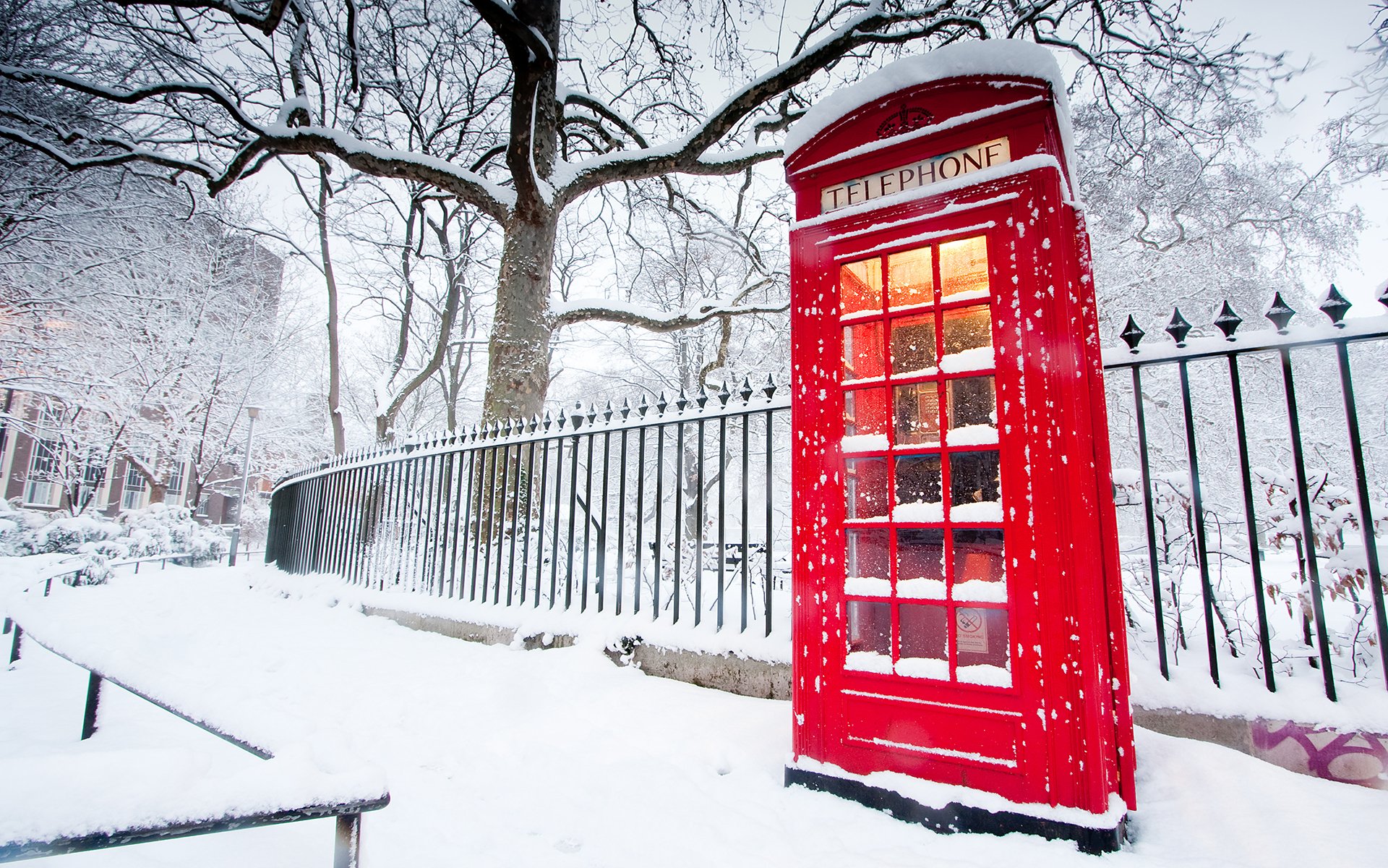 phone booth red winter fence