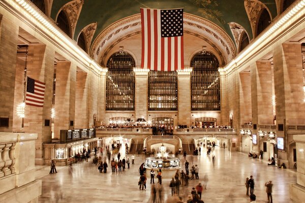 A large US flag in the station building