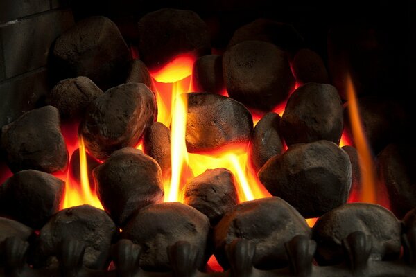 There is a fire burning in the fireplace, warmth and comfort come into the room