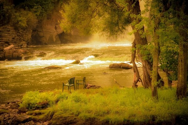 Chairs by the river in summer