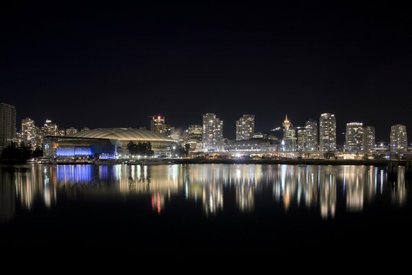 The lights of the night city reflected in the water