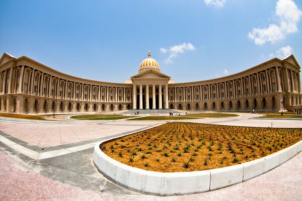 Beautiful flower beds and a building