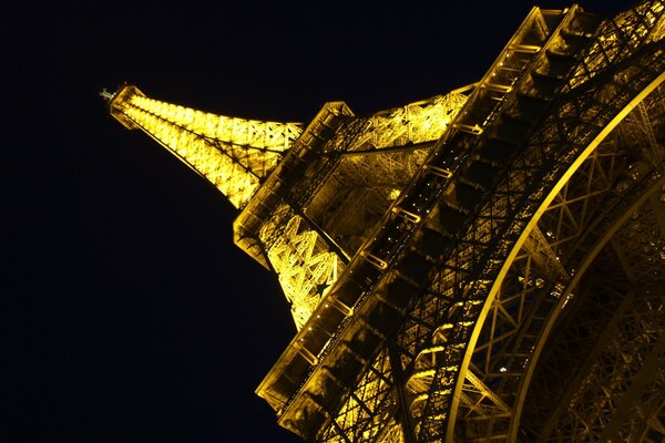 Eiffel Tower at night in an unusual angle - view from below