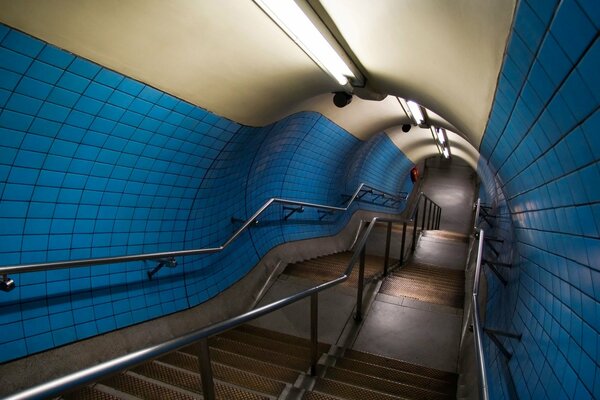 Lamp-lit descent into the tunnel