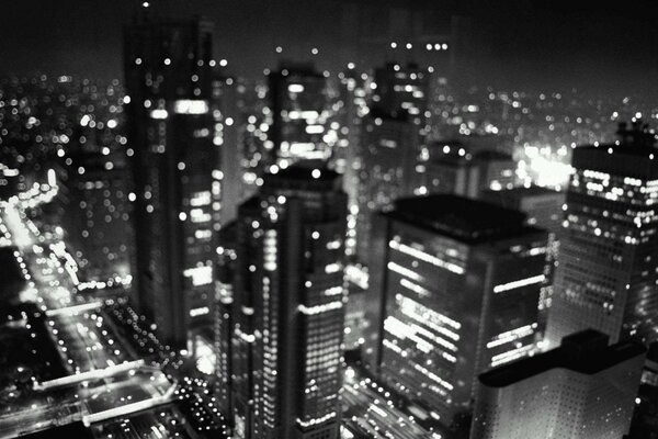 Black and white lights of skyscrapers at night