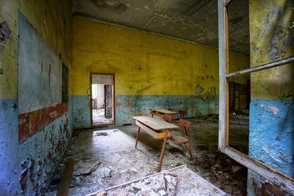 A desk in an old abandoned classroom