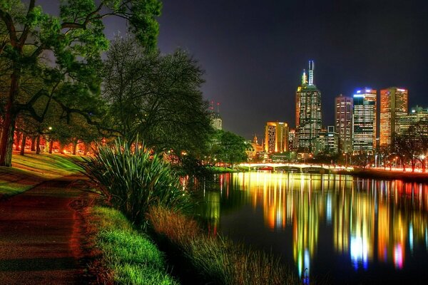 A beautiful city is displayed in the river