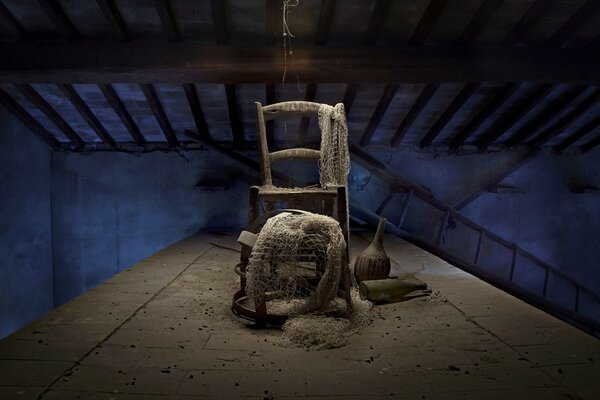 Fishing net on a chair in the attic