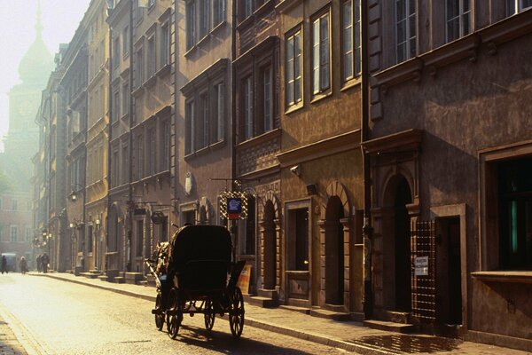 Warsaw street with a traveling carriage