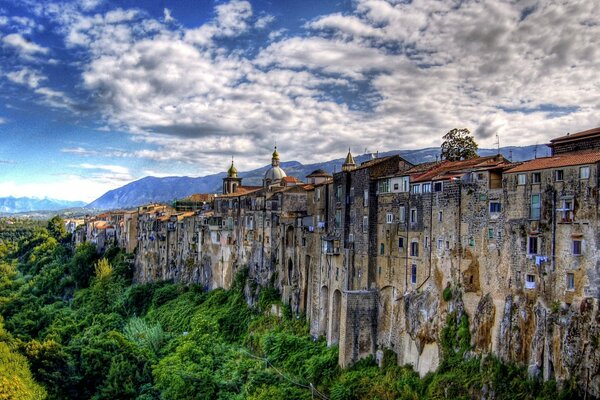 Houses located on a cliff among greenery