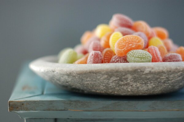 Candy in the form of fruit in a plate