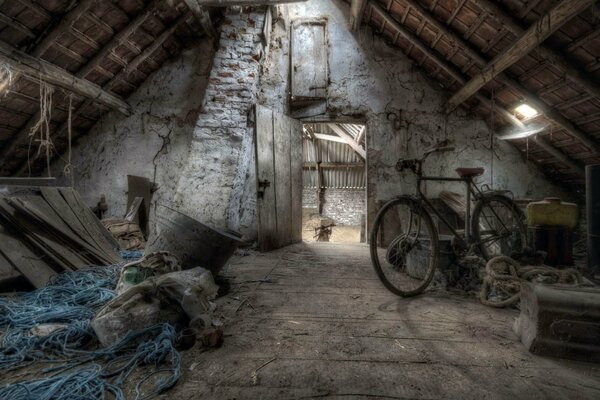 A bicycle in the attic in gloomy colors