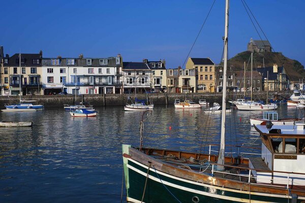 The boat is moored to a small town