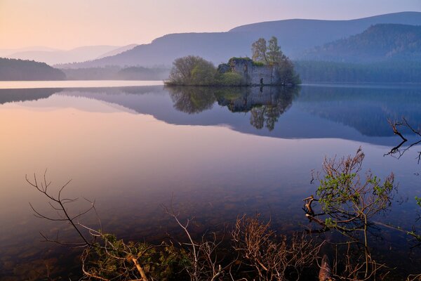 Reflection of the mountains in the lake in the evening