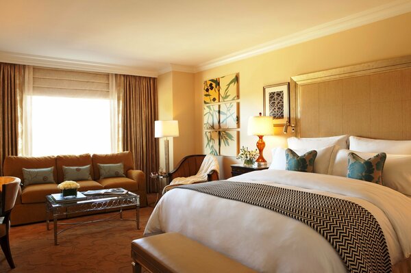 Bedroom with yellow walls and a large bed