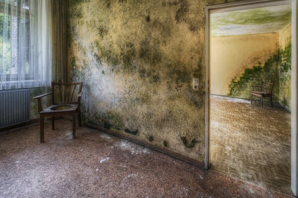 A chair in the room against the background of the window