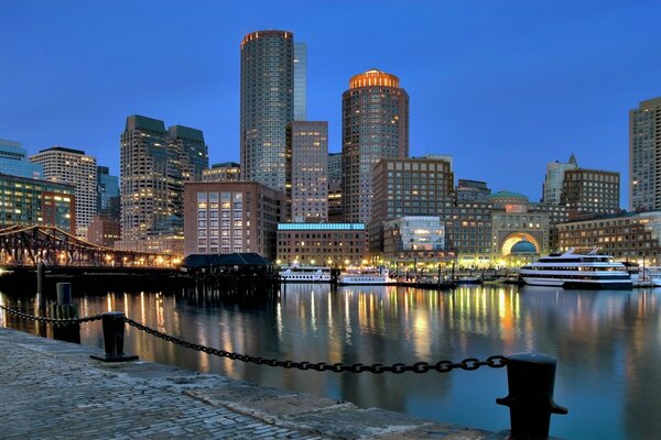 The pier and skyscrapers. Lights and water