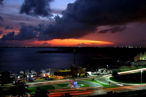 Cloudy sunset over the lights of the city