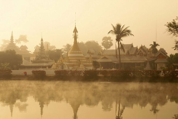 Morning in Thailand, river, temples, palm trees