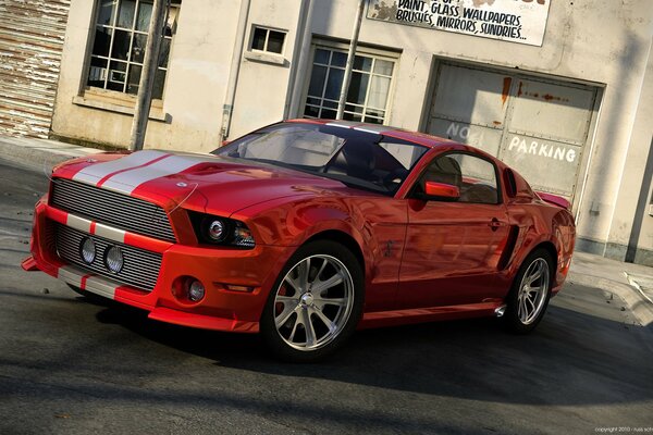 Red sports mustang with large wheels