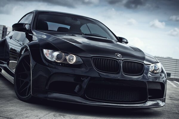 Black lowered bmw with black wheels