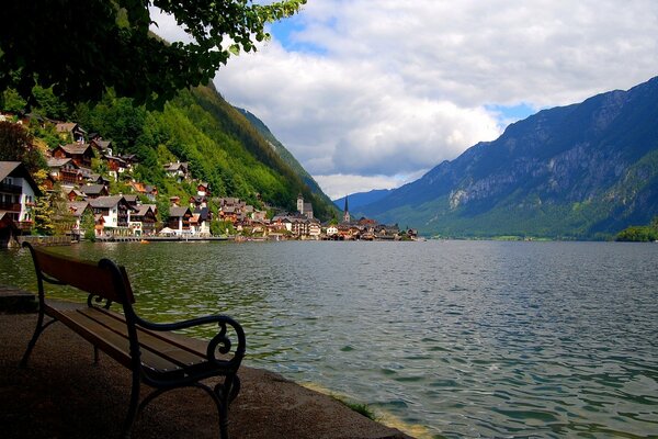 A secluded bench next to a deep lake