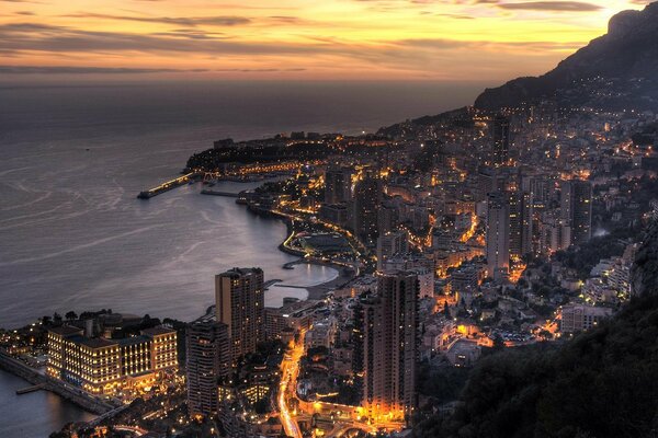 Photographing a night city on the seashore