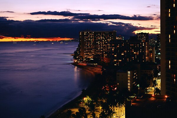 Evening lights of the building on the shore