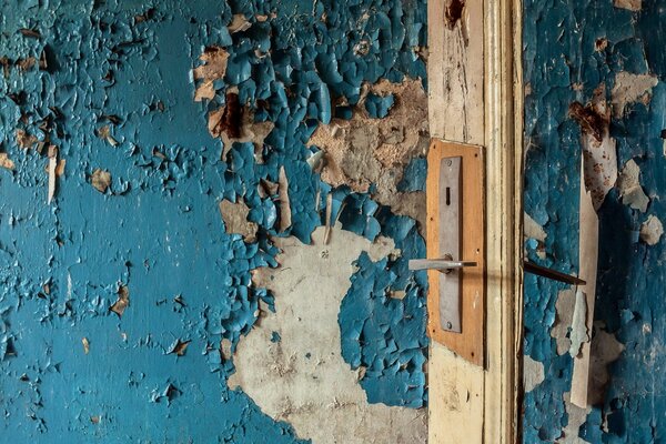 An old wall with half-finished blue paint