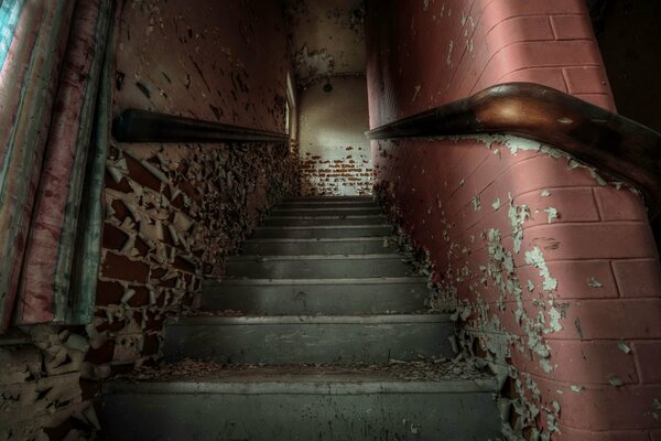 Stairs up with scuffed walls