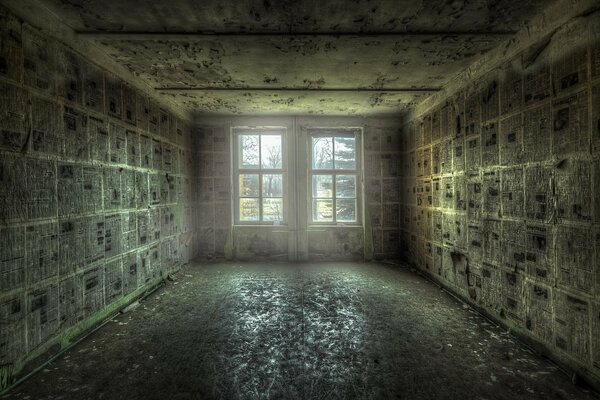 A room with walls plastered with newspapers