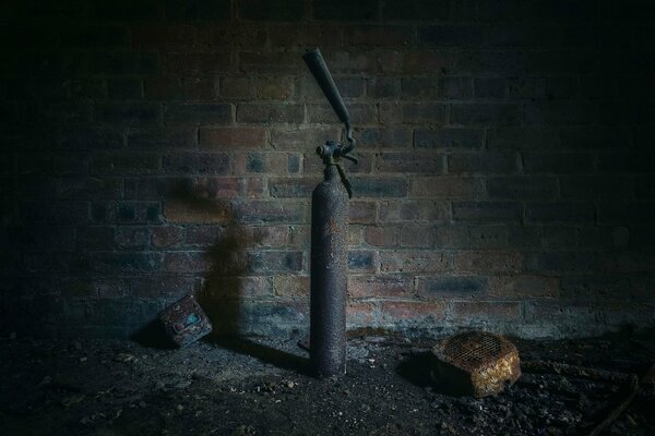 Fire extinguisher on the background of a brick wall