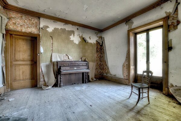 An abandoned house with an old piano