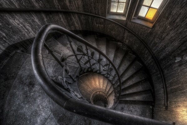 A long cable-stayed staircase passes by the window