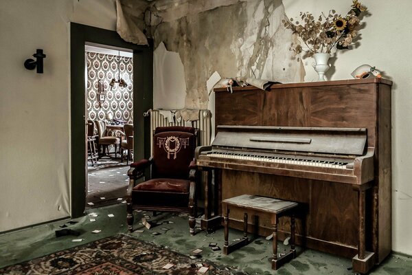 An old piano in a ruined house