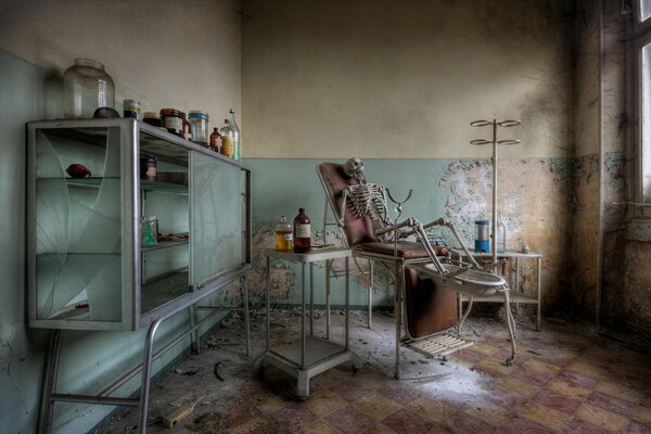 An abandoned medical office with a skeleton