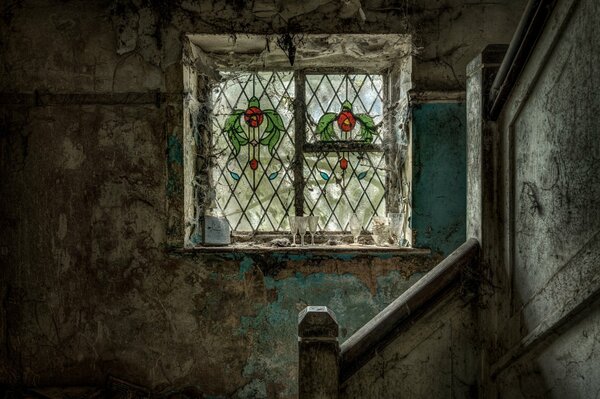 Stairs on the background of a window in a slum