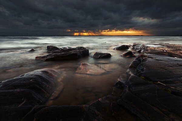 Dark sunset at the stone sea beach